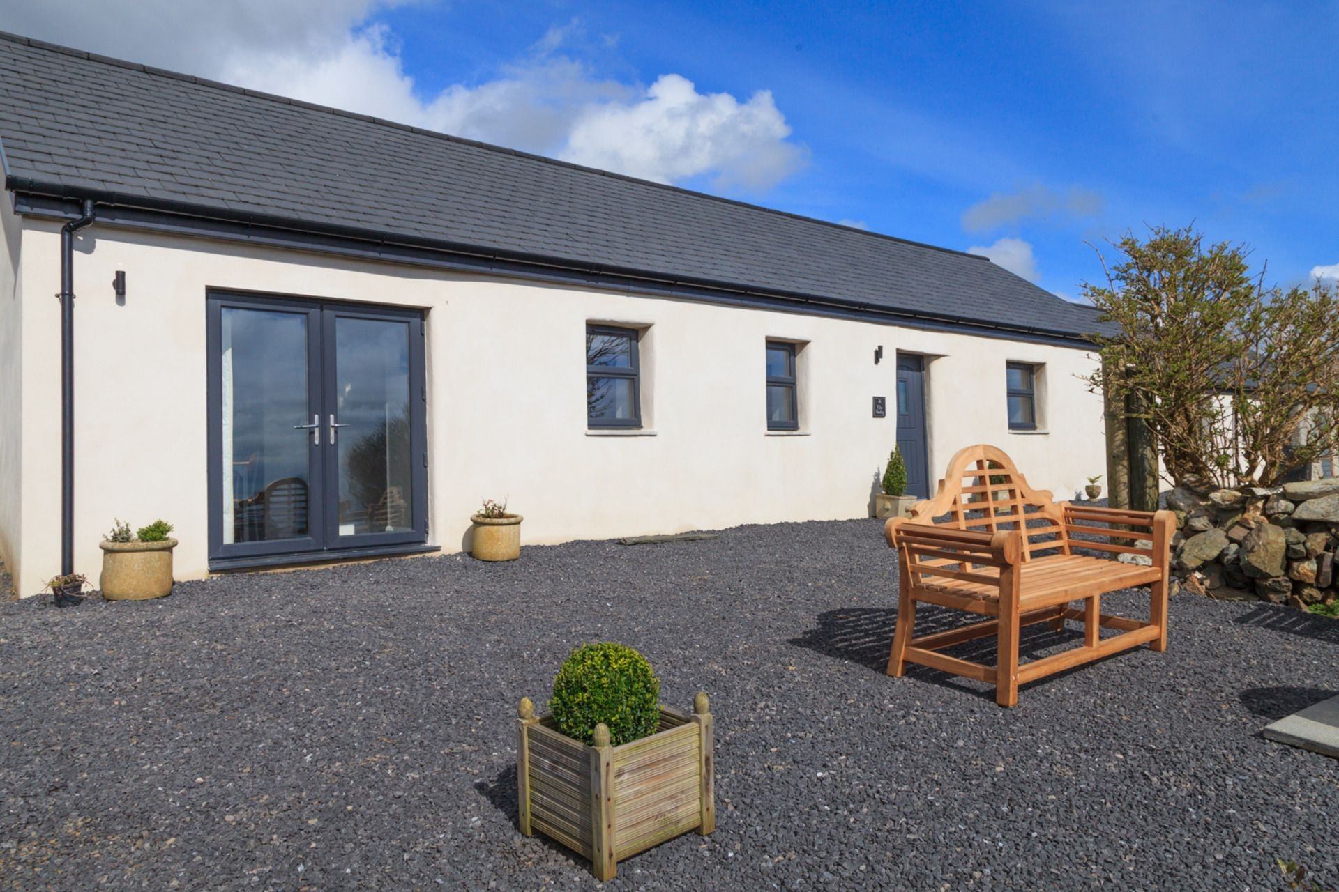 The Bothy at Ballakillowey Farm is a A beautifully renovated dairy building, offering stunning sea and farmland views.