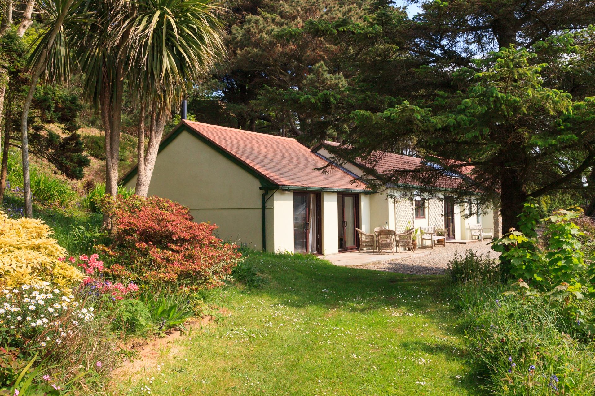 The Pines is a The Pines boasts a spectacular elevated position overlooking the coastal village of Port Erin, with