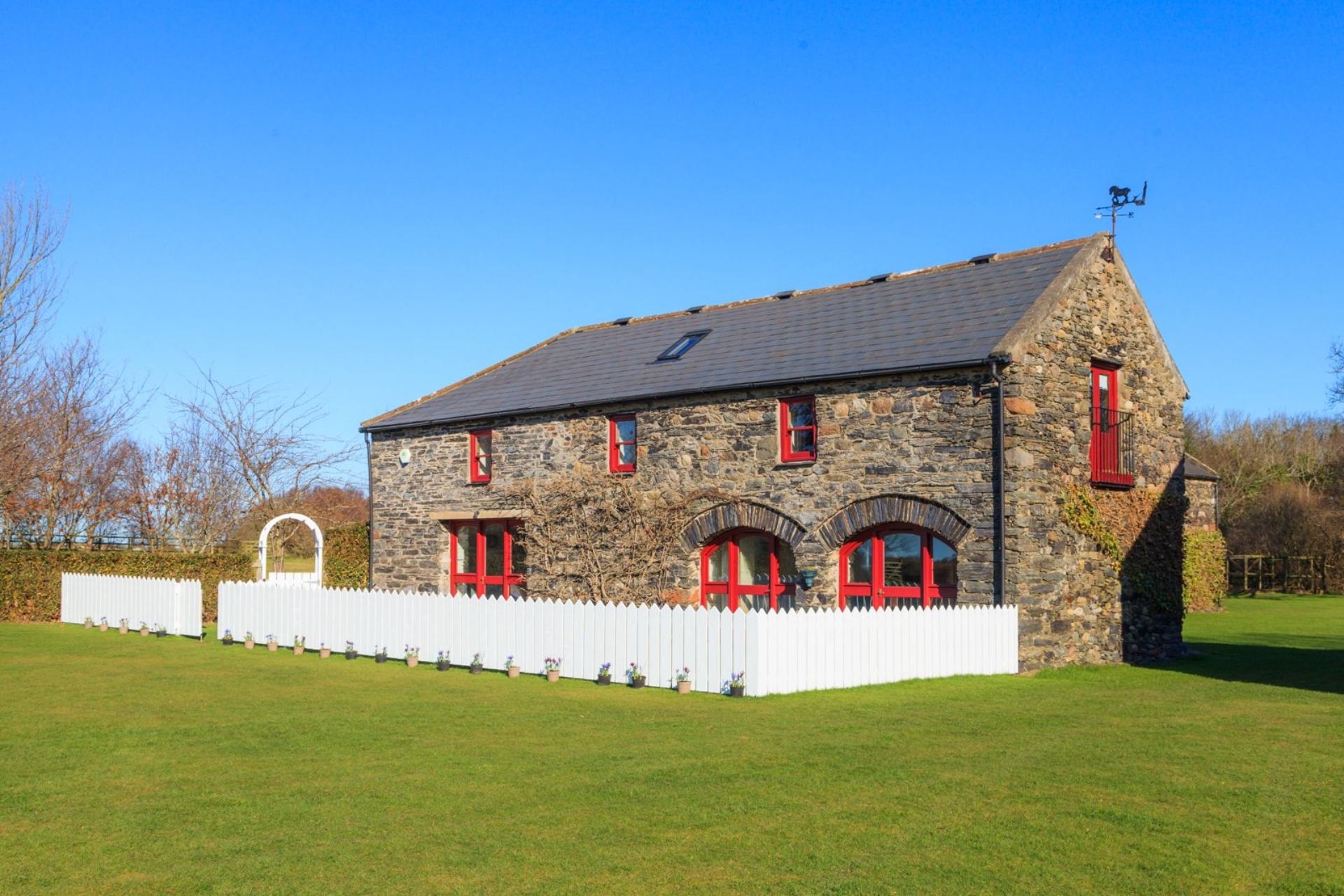 Wisteria Cottage is a Wisteria Cottage is set in the north of the Isle of Man in an expanse of farmland providing the perf