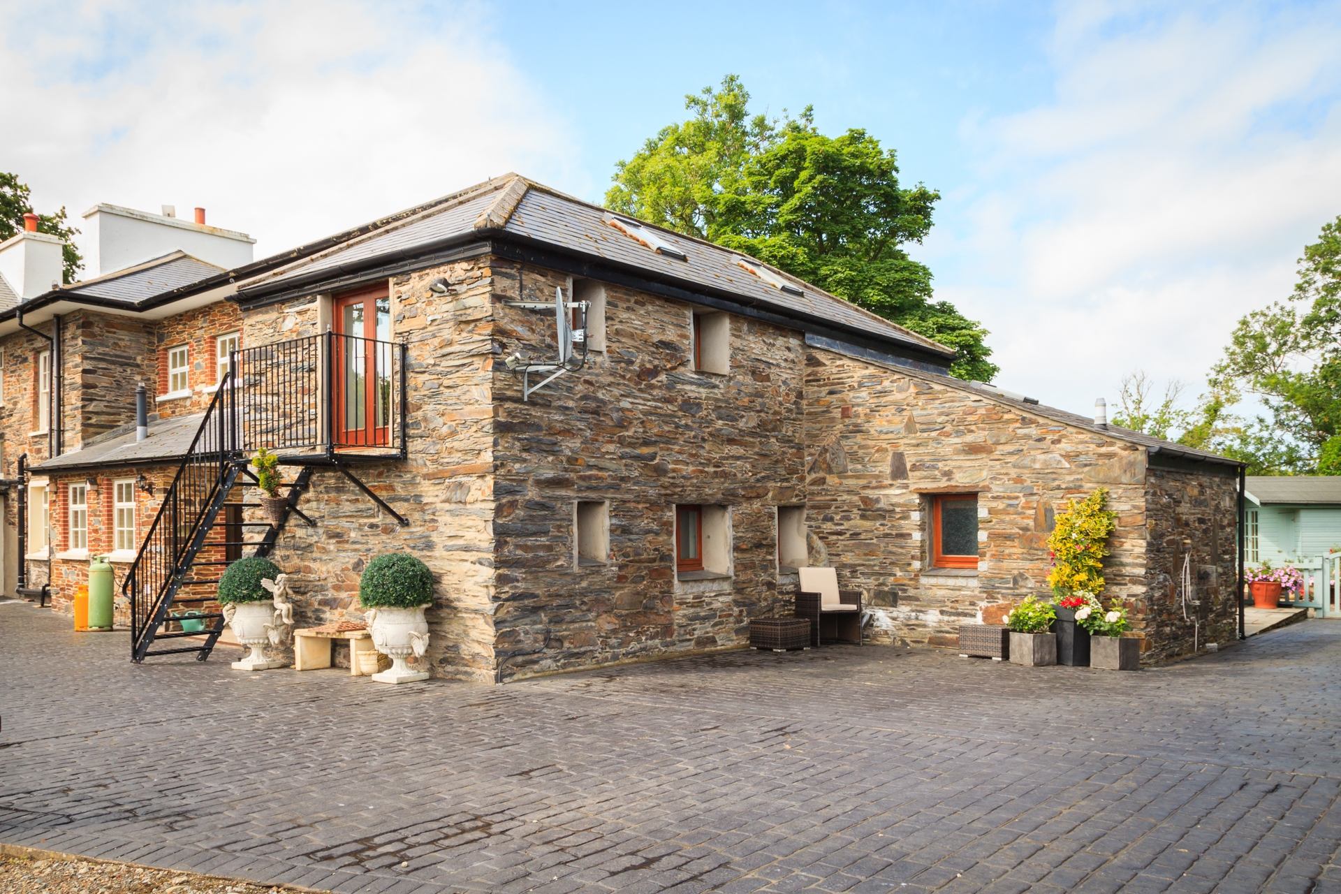 The Old Parsonage Barn is a A peaceful countryside hideaway for two beneath dark Manx skies